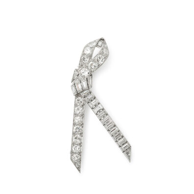 platinum and diamond knotted ribbon brooch set with brilliant and baguette diamonds