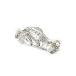 side view of rock crystal, diamond, and natural pearl brooch