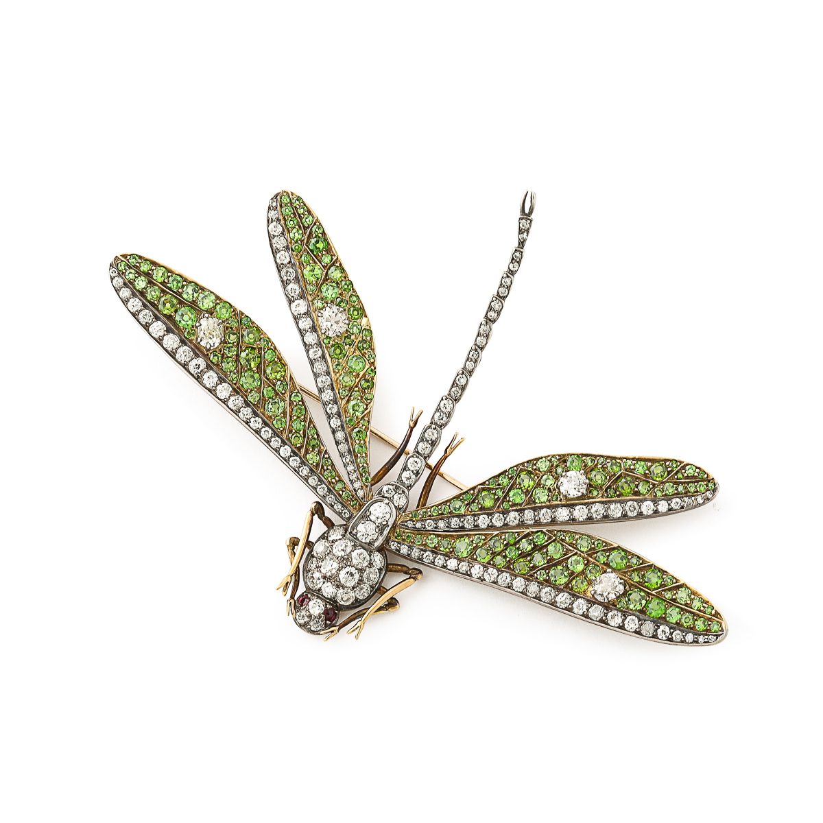 brooch in the form of a dragonfly with diamond and gold body and green garnet and diamond wings