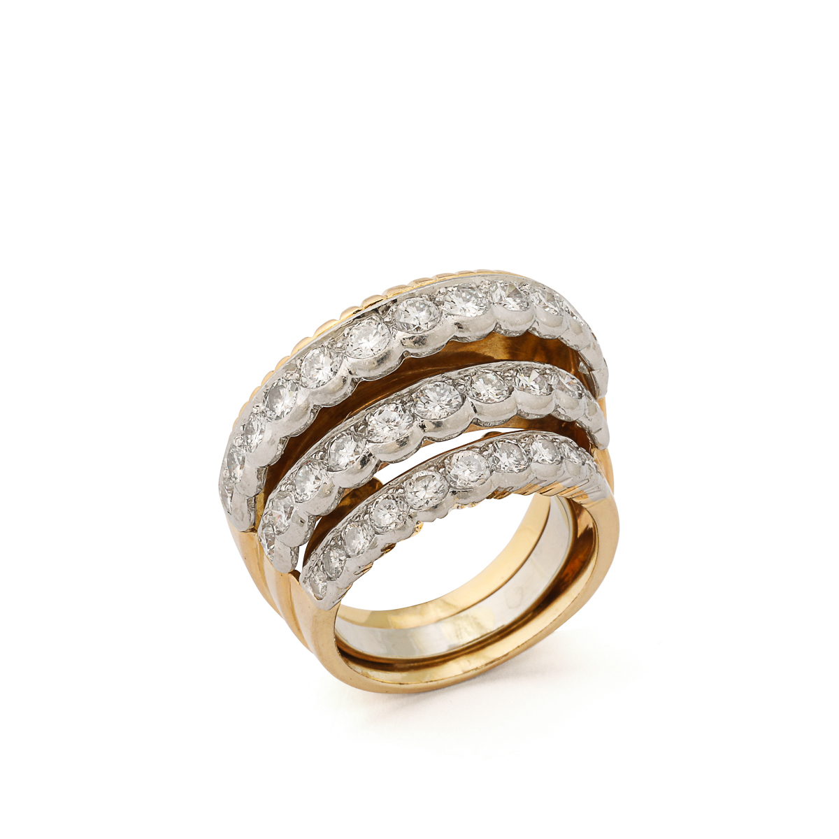 Gold and diamond bombe ring designed with three steps, or graduated hoops.