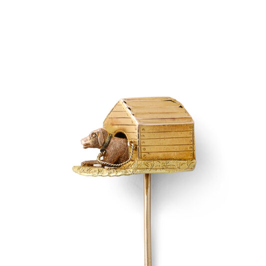 closer side view of dog in kennel stickpin