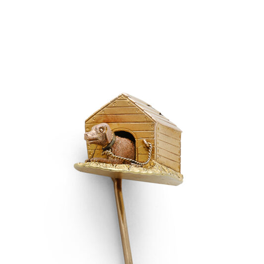 closer view of dog in kennel stickpin