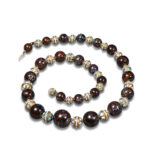 black opal bead necklace strung with gold beads, each set with carved opal