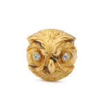 carved gold owl head with diamond eyes, mounted as a ring