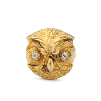 carved gold owl head with diamond eyes, mounted as a ring