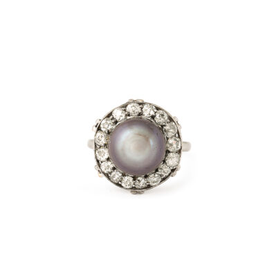 aerial view of black button pearl ring encircled with diamonds