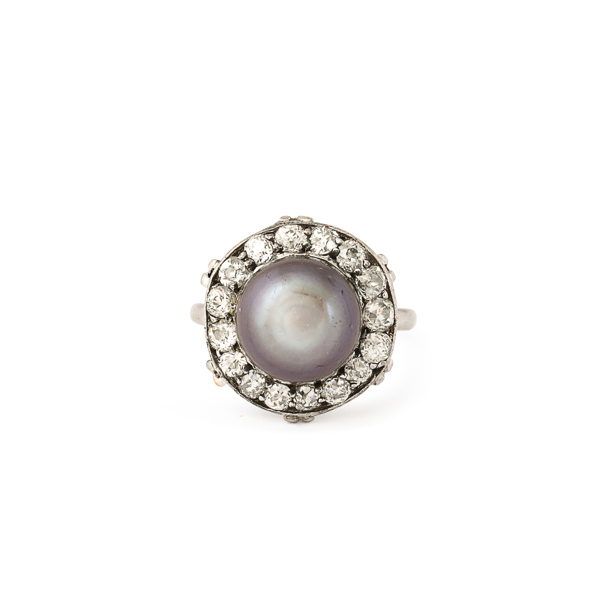 aerial view of black button pearl ring encircled with diamonds