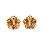 back view of gold Cartier flower head earrings