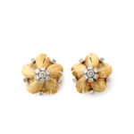 gold flower head earrings with 7-diamond cluster in the centers and a diamond between each petal