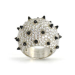 diamond ring set in white gold with onyx spikes