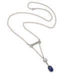 seed pearl and diamond necklace suspending a cabochon sapphire