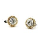 old mine diamond cluster earrings, the central diamond of each surrounded by natural yellow diamonds